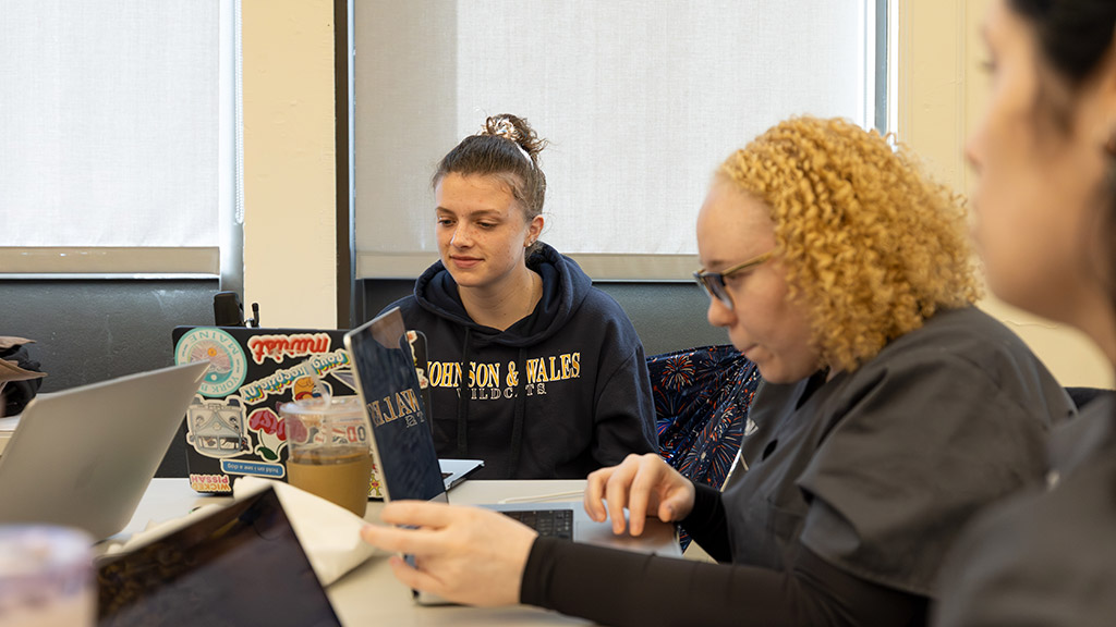 an OTD and an MSCND student work together at a table