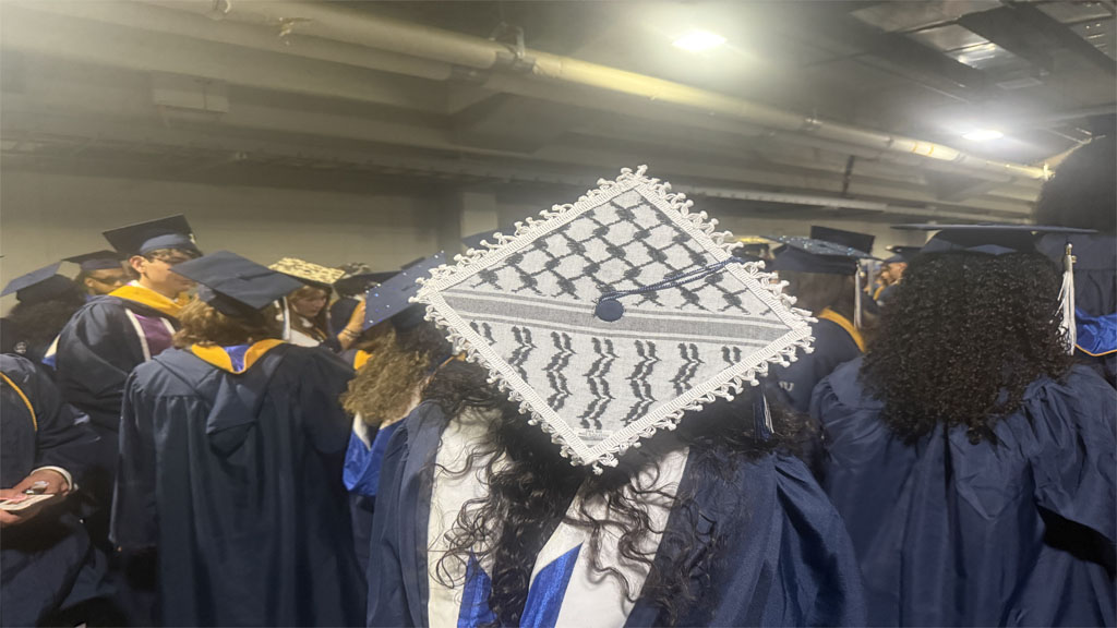 Mayara Haddad showing off keffiyeh decorated grad cap