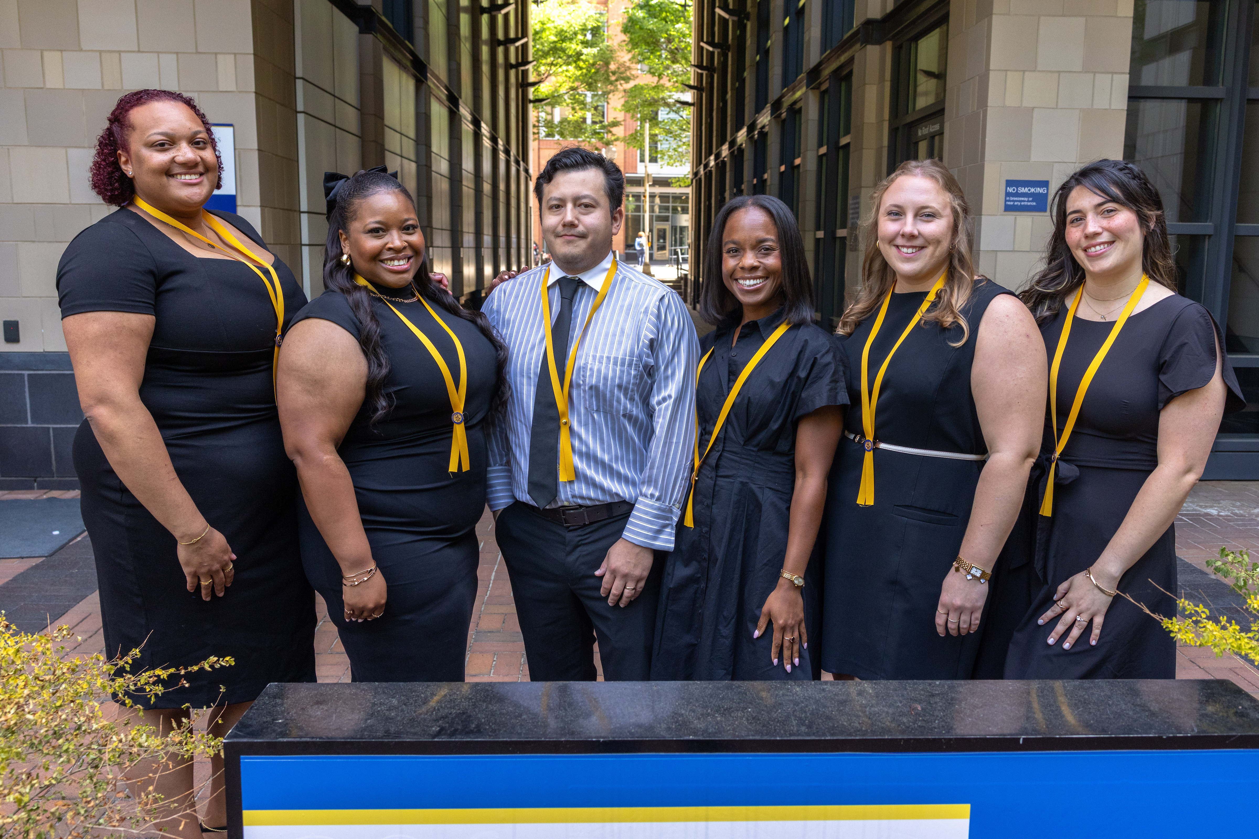 JWU Charlotte's 2026 ABSN graduates pose together outside