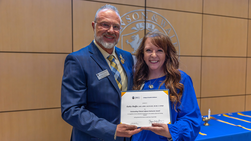 David Hudson awards a plaque to Kathy Shaffer