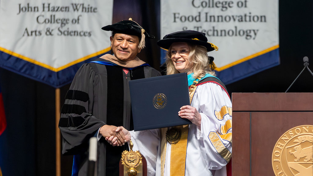 Aby Alexander ’26 Hon. with Chancellor Runey