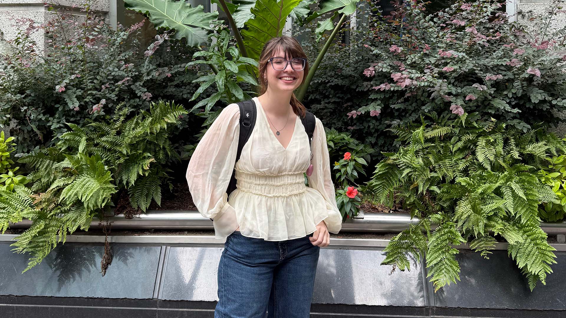 Teagan Bradford in front of plants