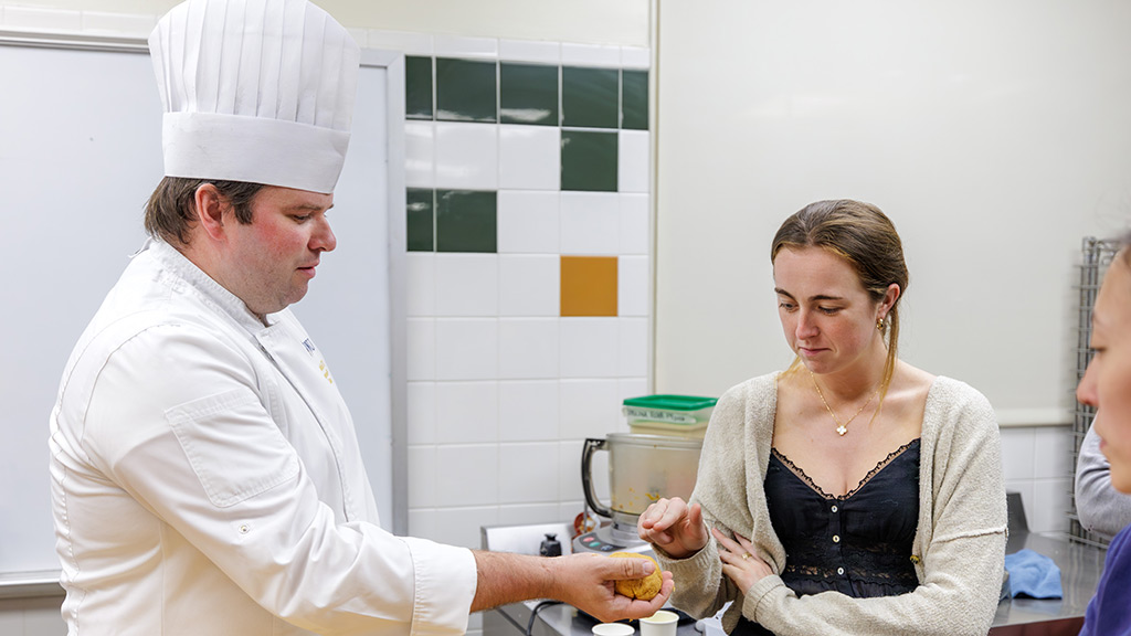 Associate Professor Makuch engages with a Brown medical student