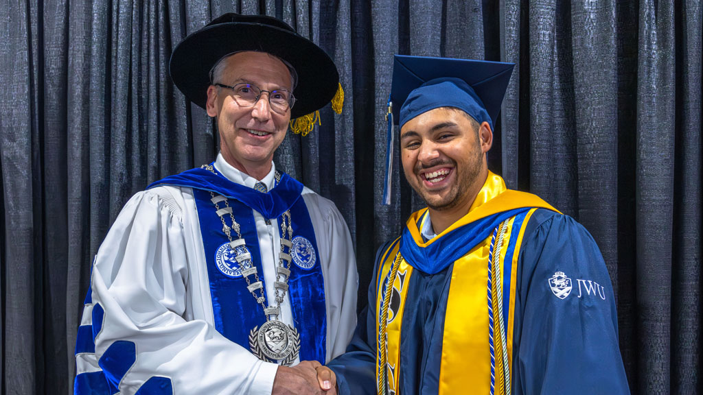 John Billinis ’26 with Charlotte Campus President Richard Mathieu, Ph.D.