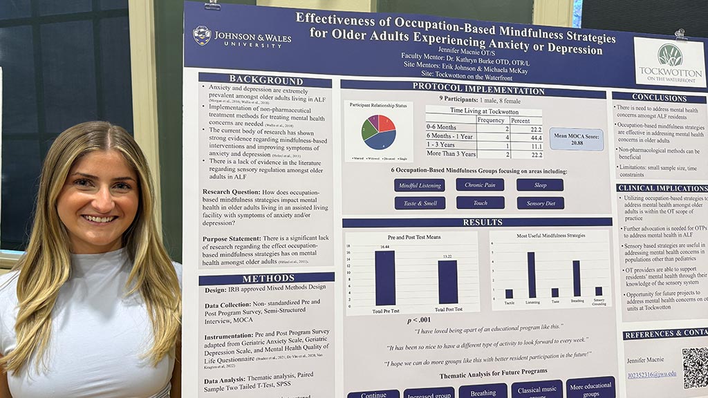 Jennifer Macnie '26 OTD with her capstone poster