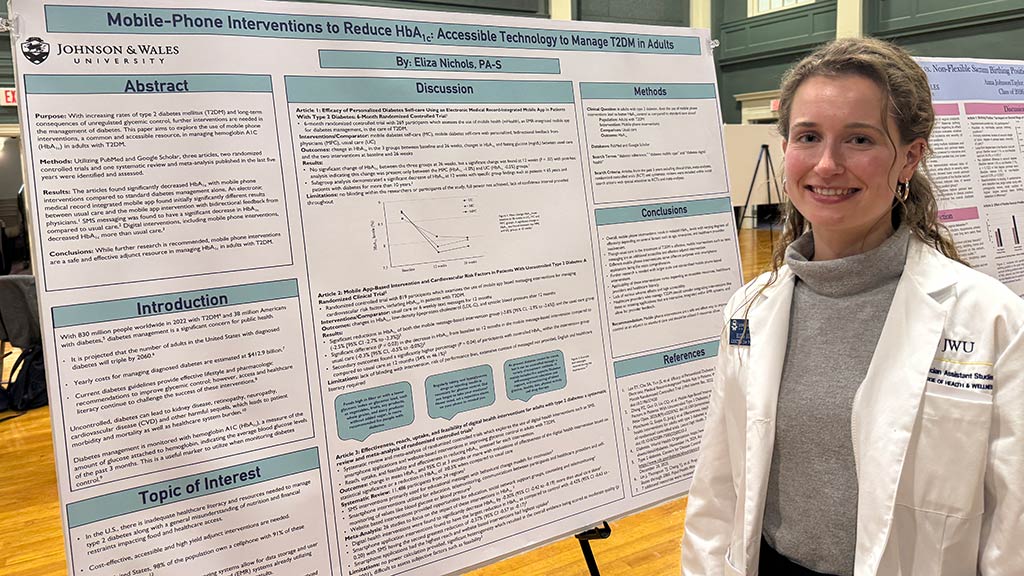Eliza Nichols '26 MSPAS with her capstone poster