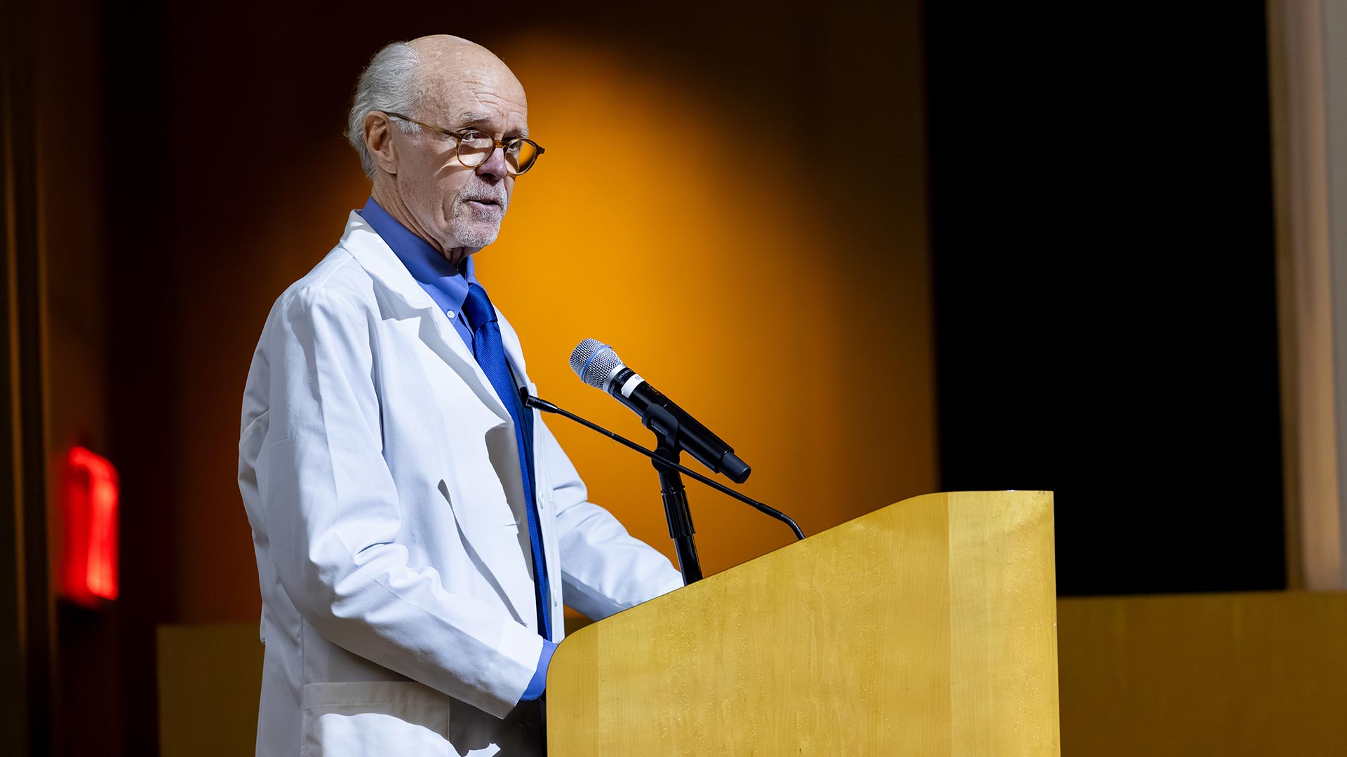 George S. Bottomley, DVM, PA-C, speaks at a podium