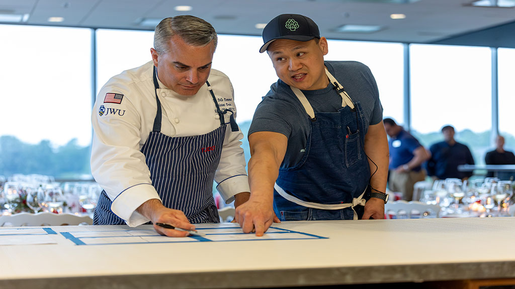 Chef Shi Mei speaking with TJ Delle Donne