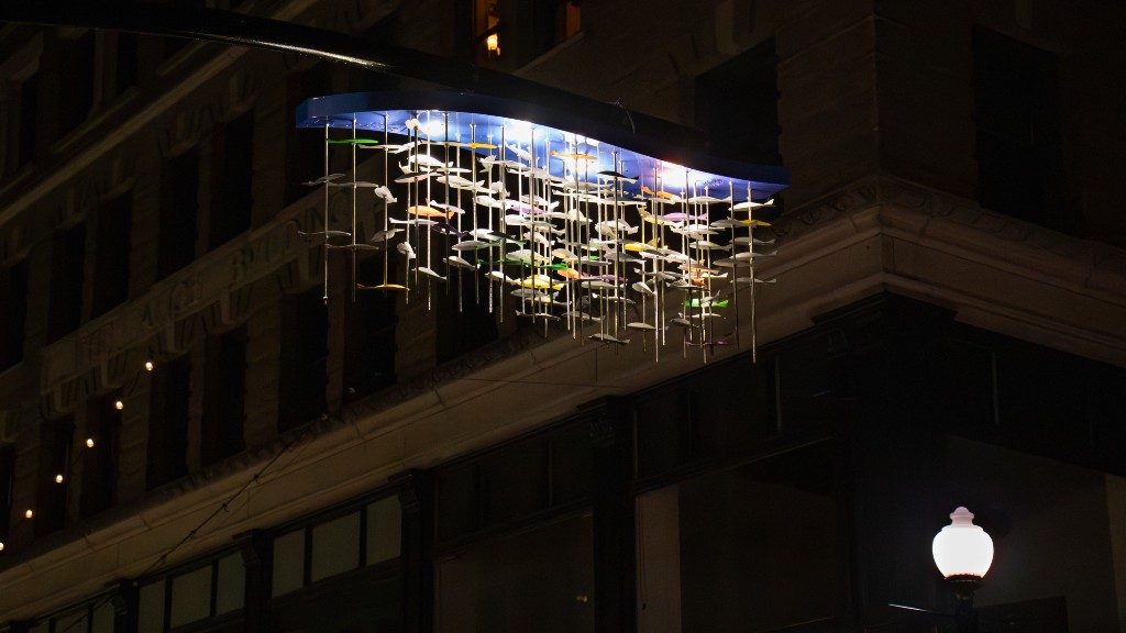 school of fish sculpture at night