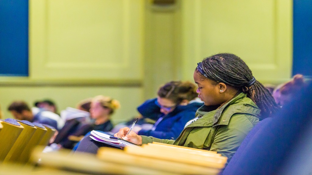 Liberal Arts student takes notes at human rights seminar