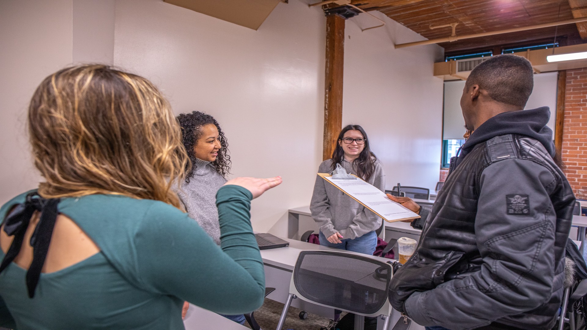 students working together in liberal arts class banner