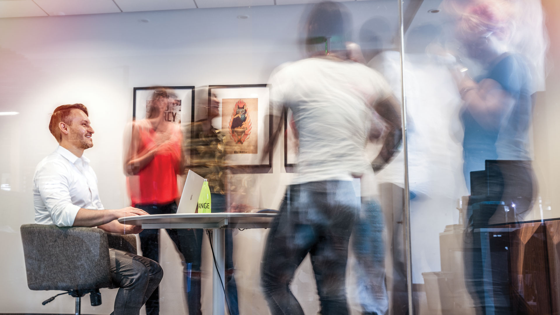 Graphic of Jeff Jordan at work in office with staff members