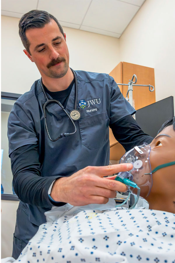 First-year student Max Glaser practices basic techniques in the sim lab.